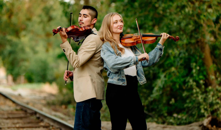 Downbeat Duo Violin And Viola Musicians Performing Outdoors In Los Angeles