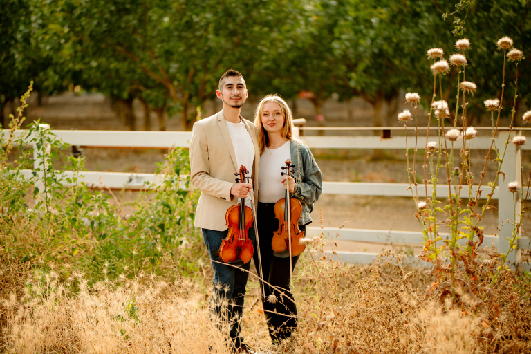 Downbeat Duo Violin And Viola Musicians Outdoors In Los Angeles