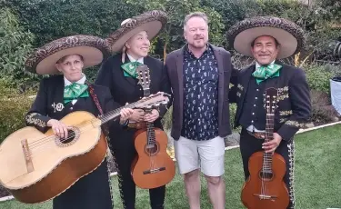 La Familia mariachi trio performing live music at a private event