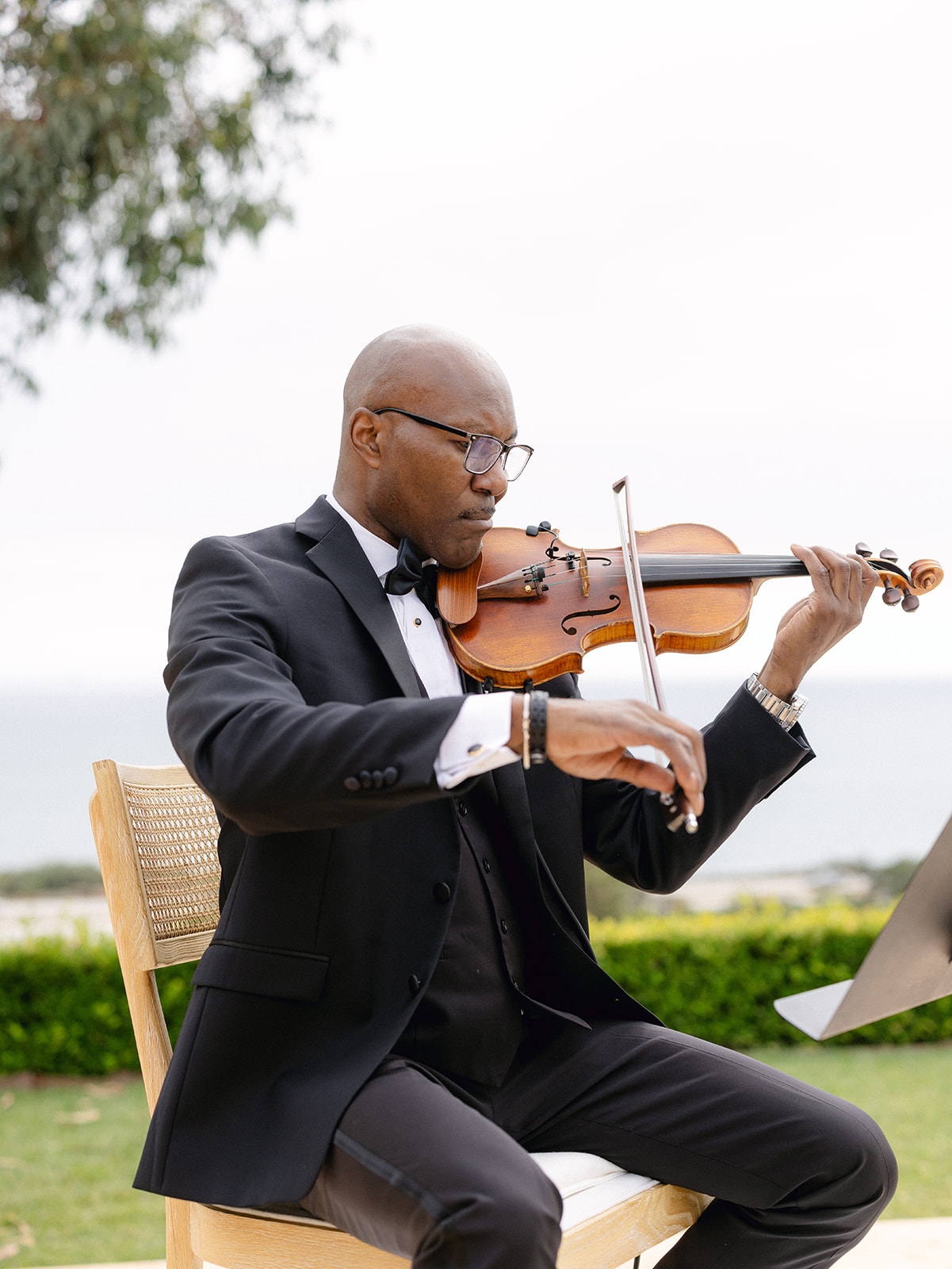 String musicians performing at an outdoor wedding