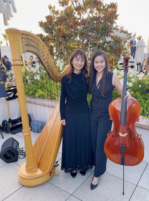 Tomoko performing harp music during a wedding ceremony