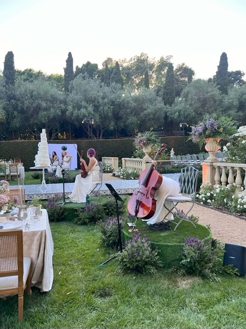 All-Female String Quartet Performing At An Outdoor Event