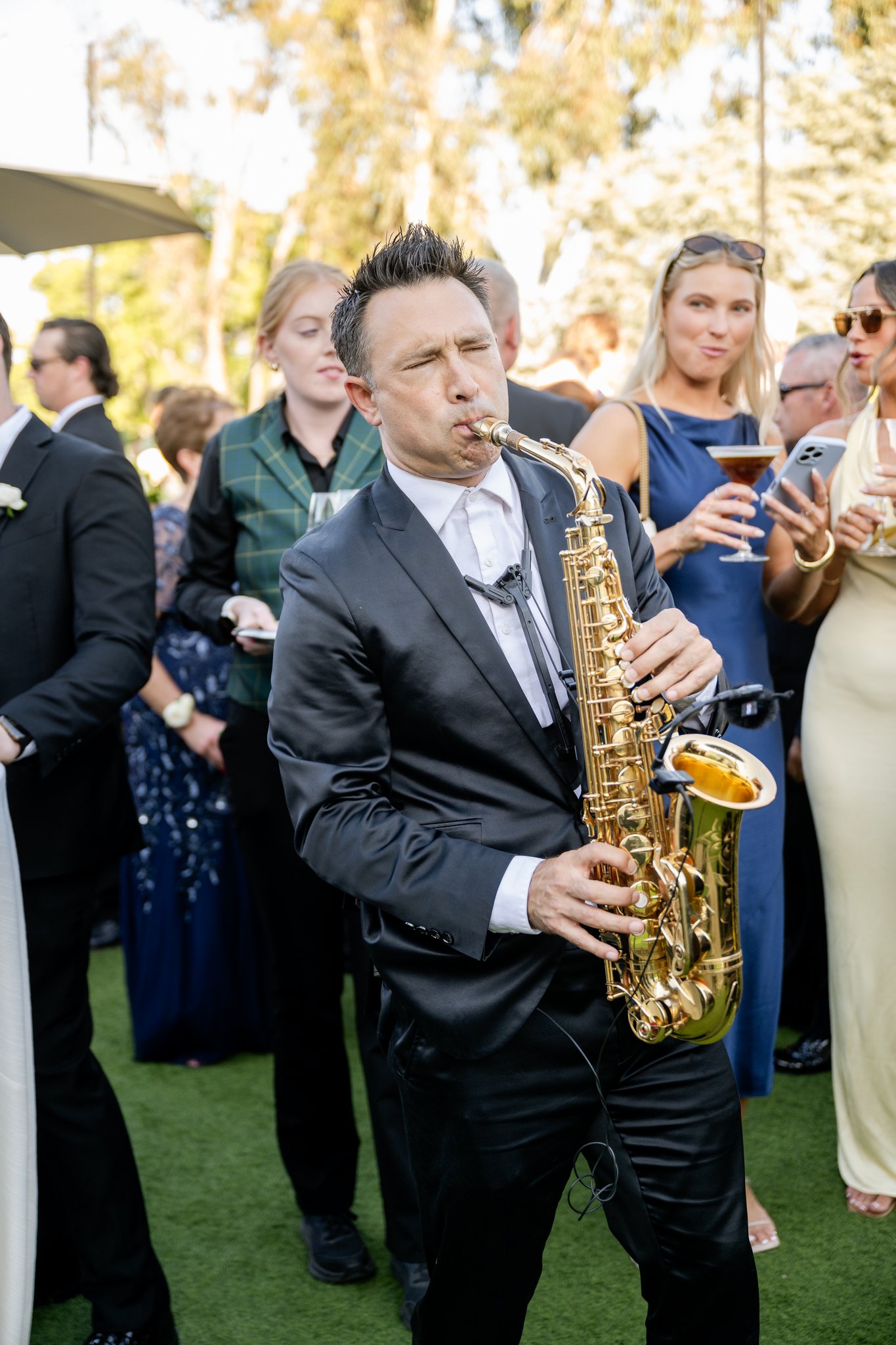 Kevin playing saxophone during cocktail hour