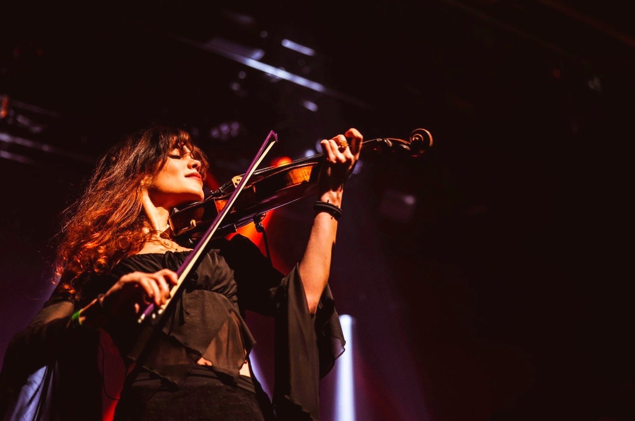 Miriam, a Los Angeles violinist, performing live at an event