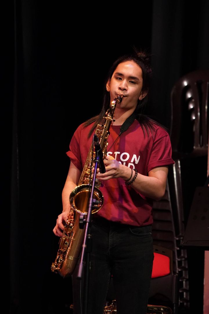 De Leon Brothers saxophonist performing live on stage