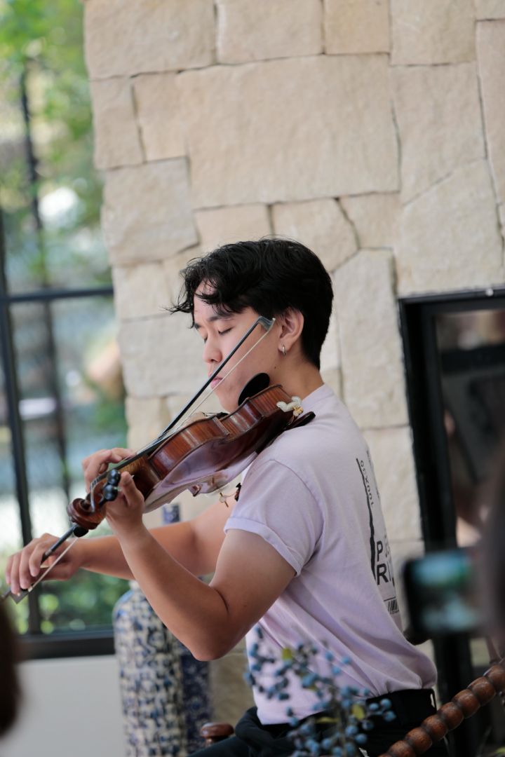 Gabe performing live violin at a private event