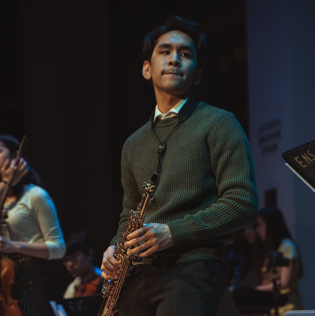 De Leon Brothers saxophonist giving a contemporary live stage performance
