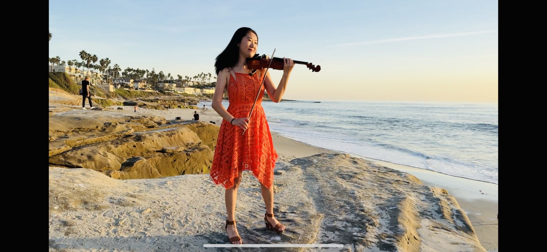 Tingting Performing Violin Near The Beach At Sunset