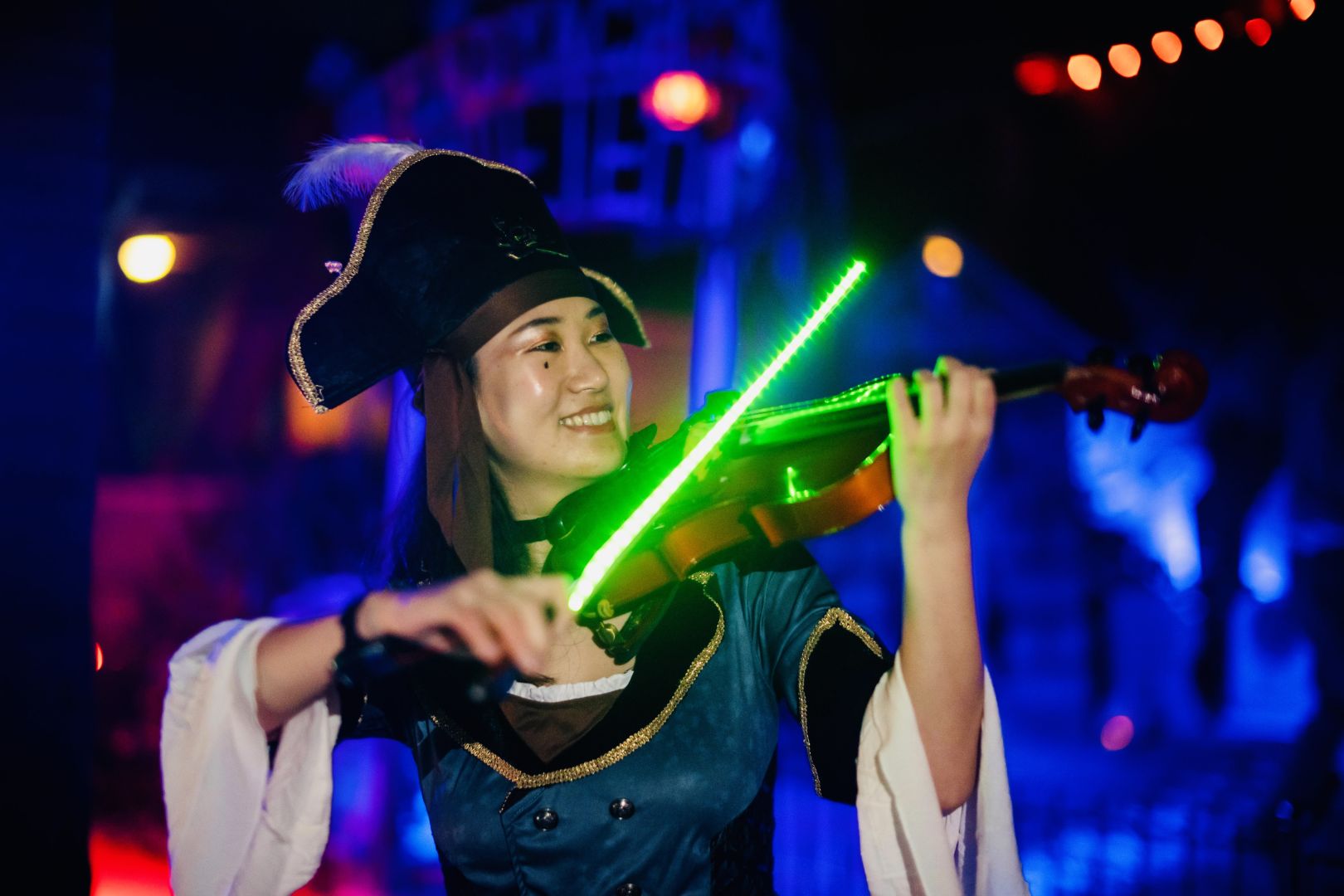 Tingting Performing Led Violin Entertainment At A Themed Event