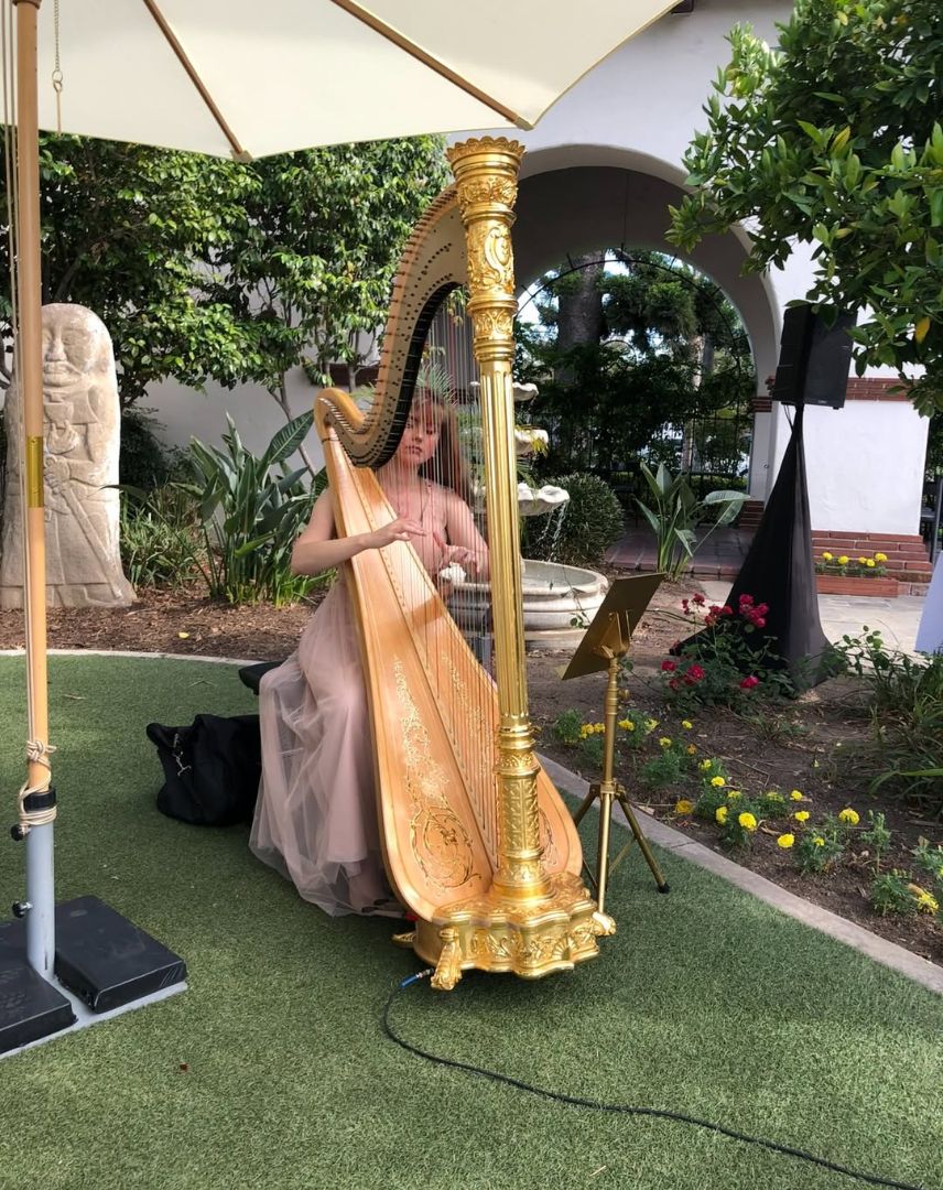 Wedding harpist performing live ceremony music at a Southern California wedding