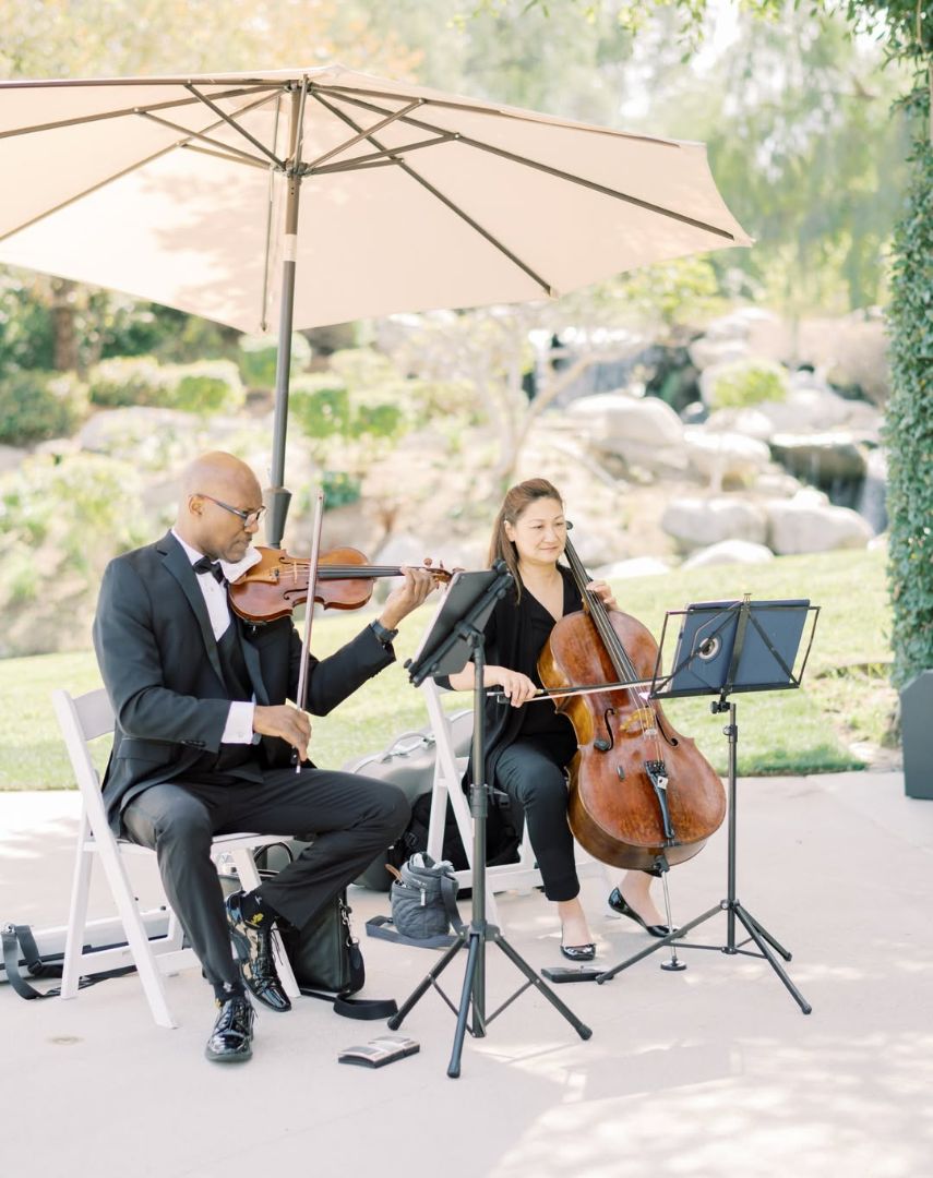 Wedding violin and cello duo performing live cocktail hour music