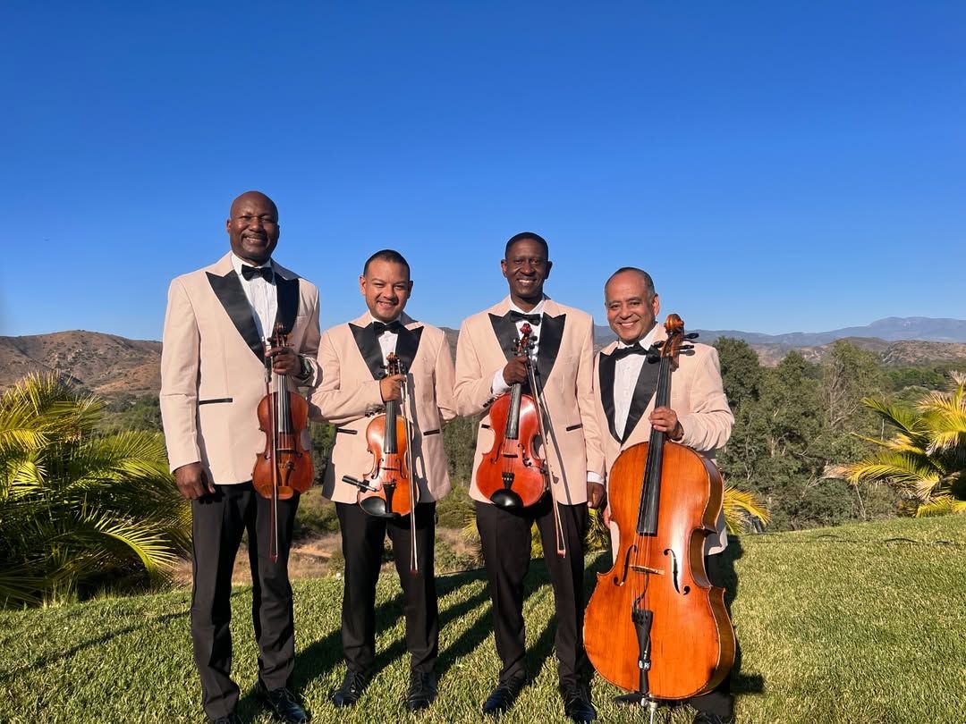 Wedding string quartet performing live music at a Southern California wedding venue