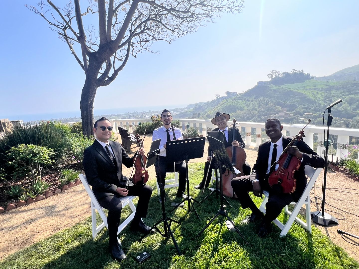 Wedding string quartet performing at an outdoor Malibu venue